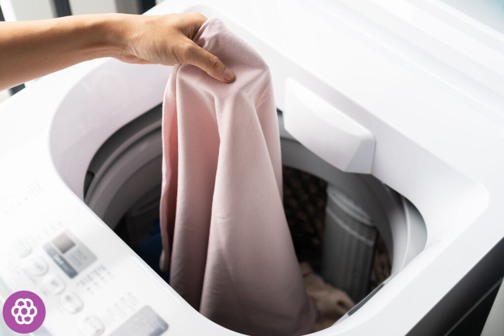 miten puhdistaa ylhäältä täytettävän pesukoneen rumpu?
